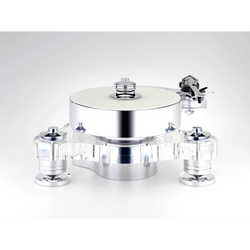 TRANSROTOR RONDINO BIANCO FMD TURNTABLE | VINYL SOUND Rondino Bianco FMD comes in a Solid Clear Acrylic Frame of polished Aluminum & Acrylic in a sandwich construction, 70mm Aluminum platter (10kg) FMD (Free Magnetic Drive) bearing and the option to equip up to 3 tone arm bases. Transrotor FMD bearing works by magnetically coupling the motors and the magnetic drive platter assembly.