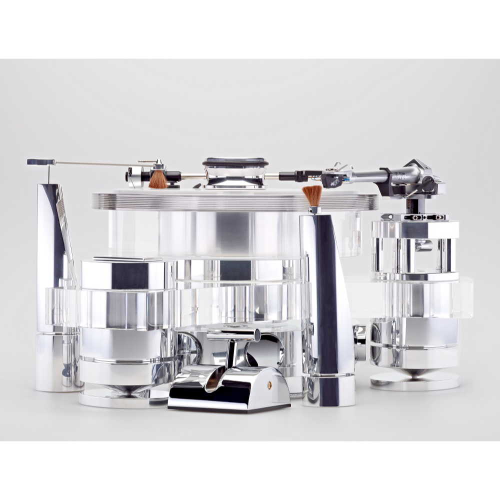 TRANSROTOR TOURBILLION FMD TURNTABLE | VINYL SOUND Tourbillon FMD is second from the top-of-the-line Transrotor turntable. It features a combination of Polished Aluminum Clear Acrylic chassis, an 80mm Acrylic platter, Rotor Ring, FMD (Free Magnetic Drive) bearing and the option to equip up to two 9 or 12-inch tone arm board.